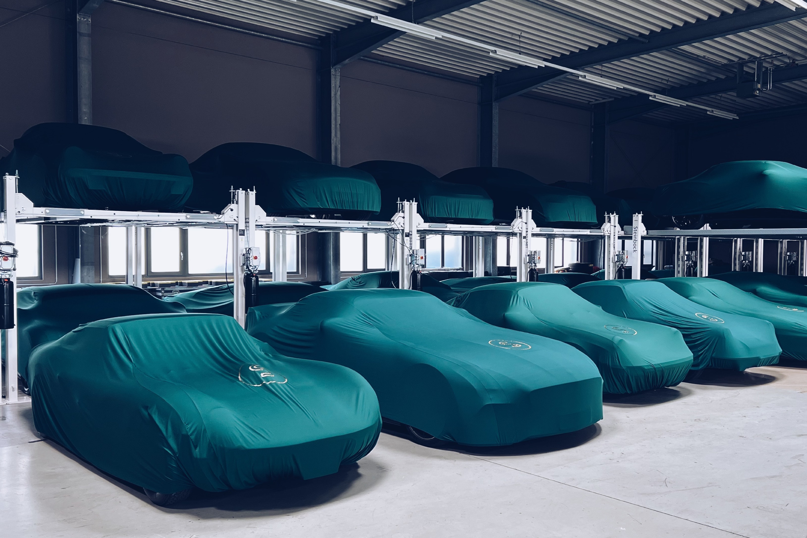 Covered collector cars in the Schaltkulisse storage facility.
