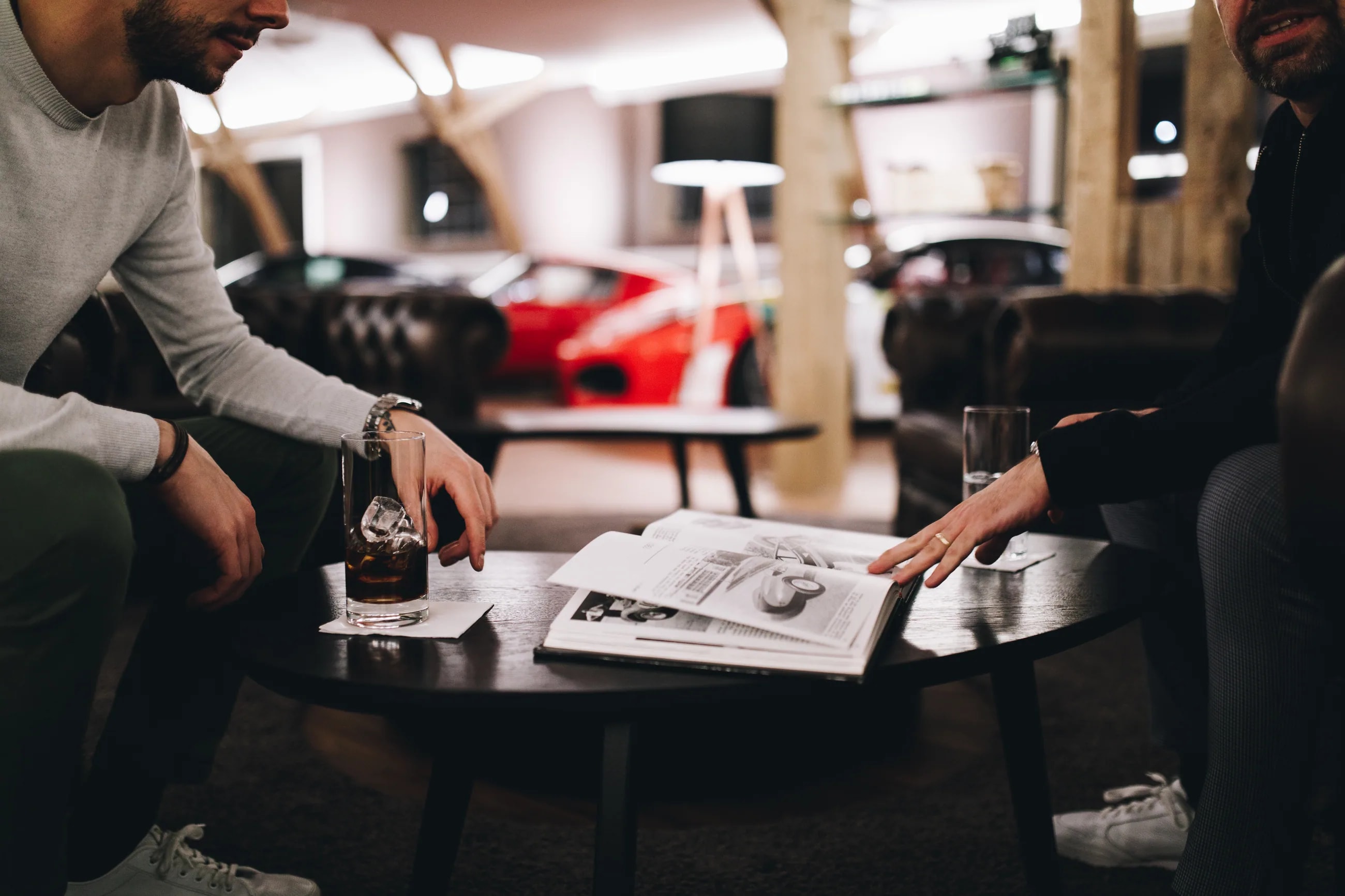 Provenance and documentation examined over a car's file.