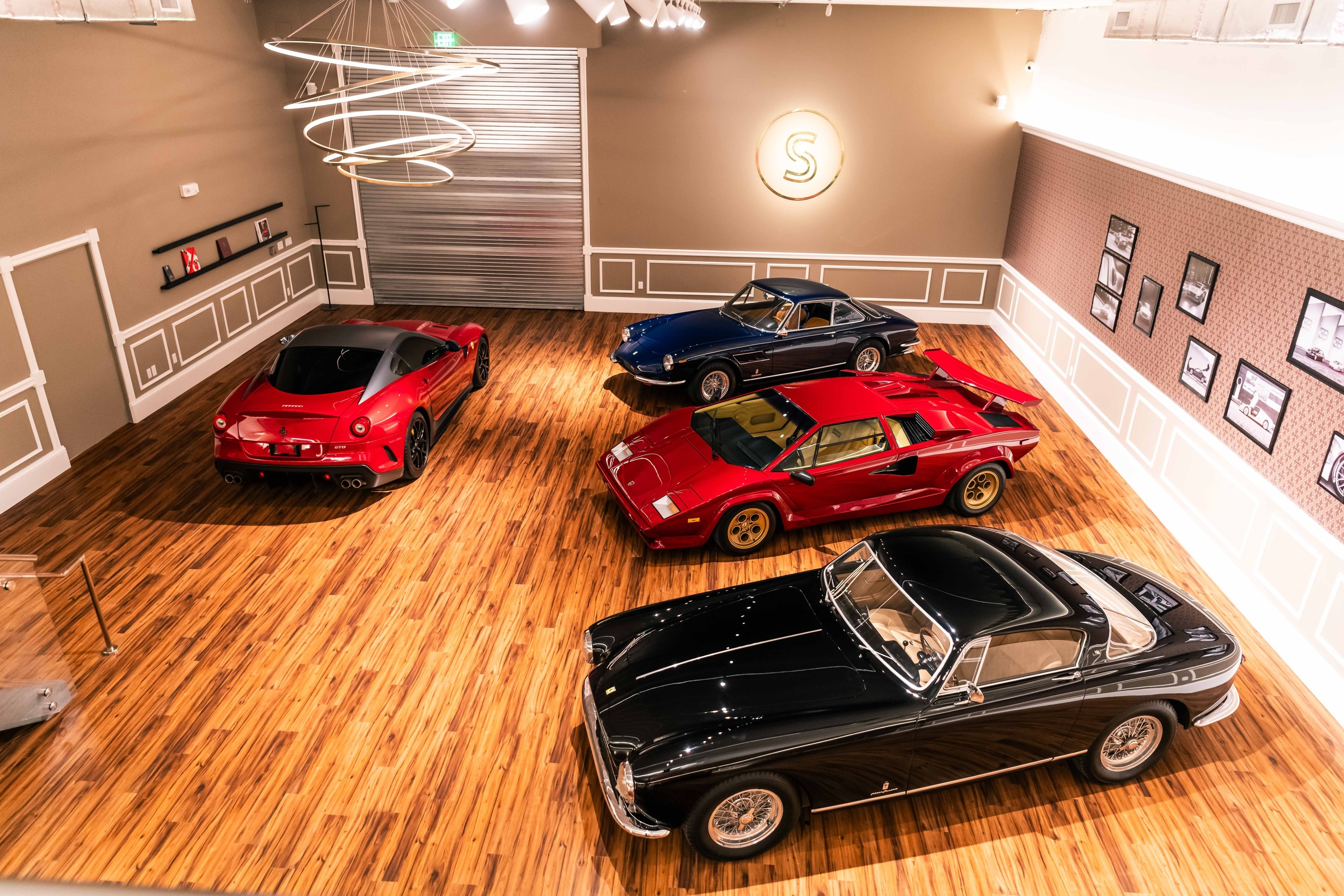Inside the Schaltkulisse Miami showroom: four cars on the timber floor